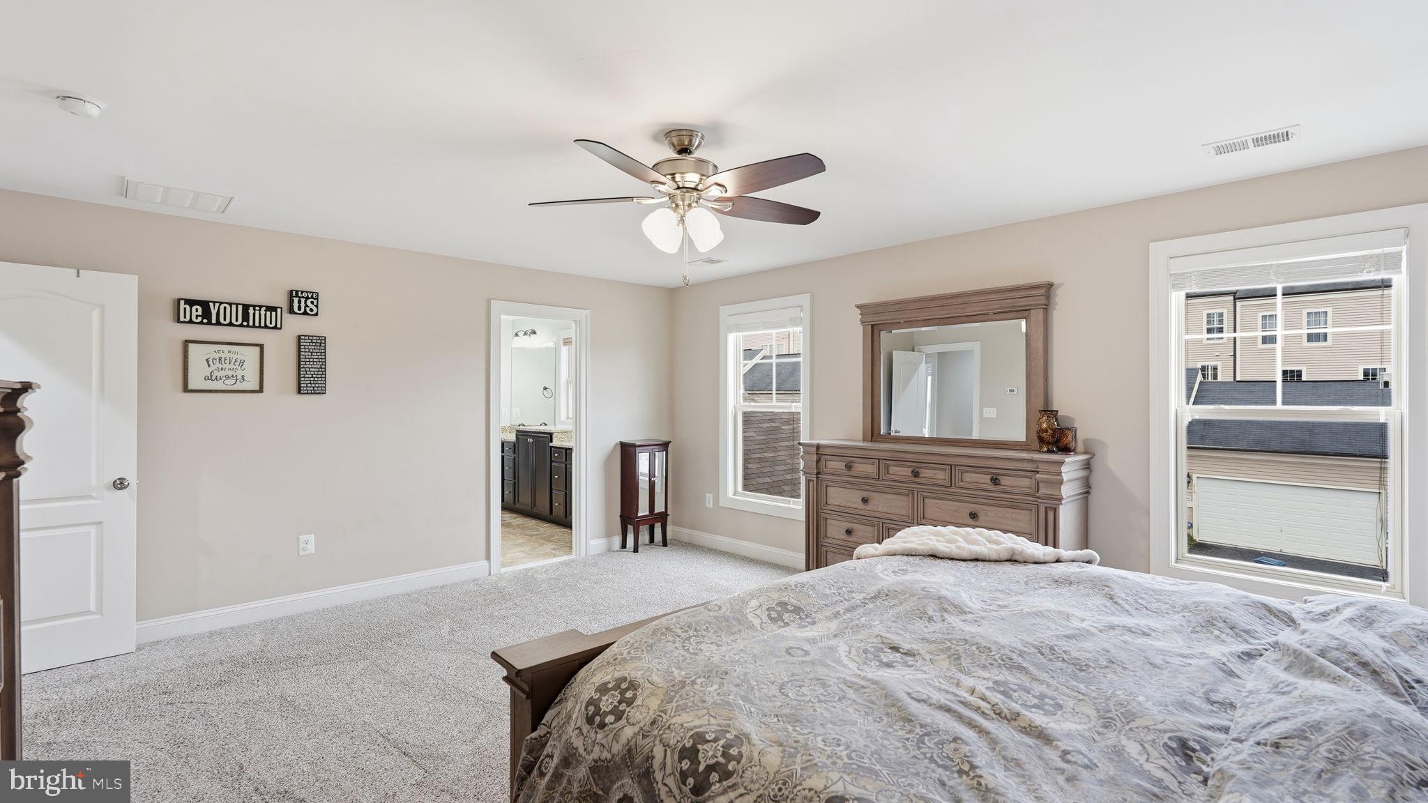 111 Pear Blossom Road Stafford, VA 22554 - Photo 20 of 68 a bedroom with a large bed and dresser