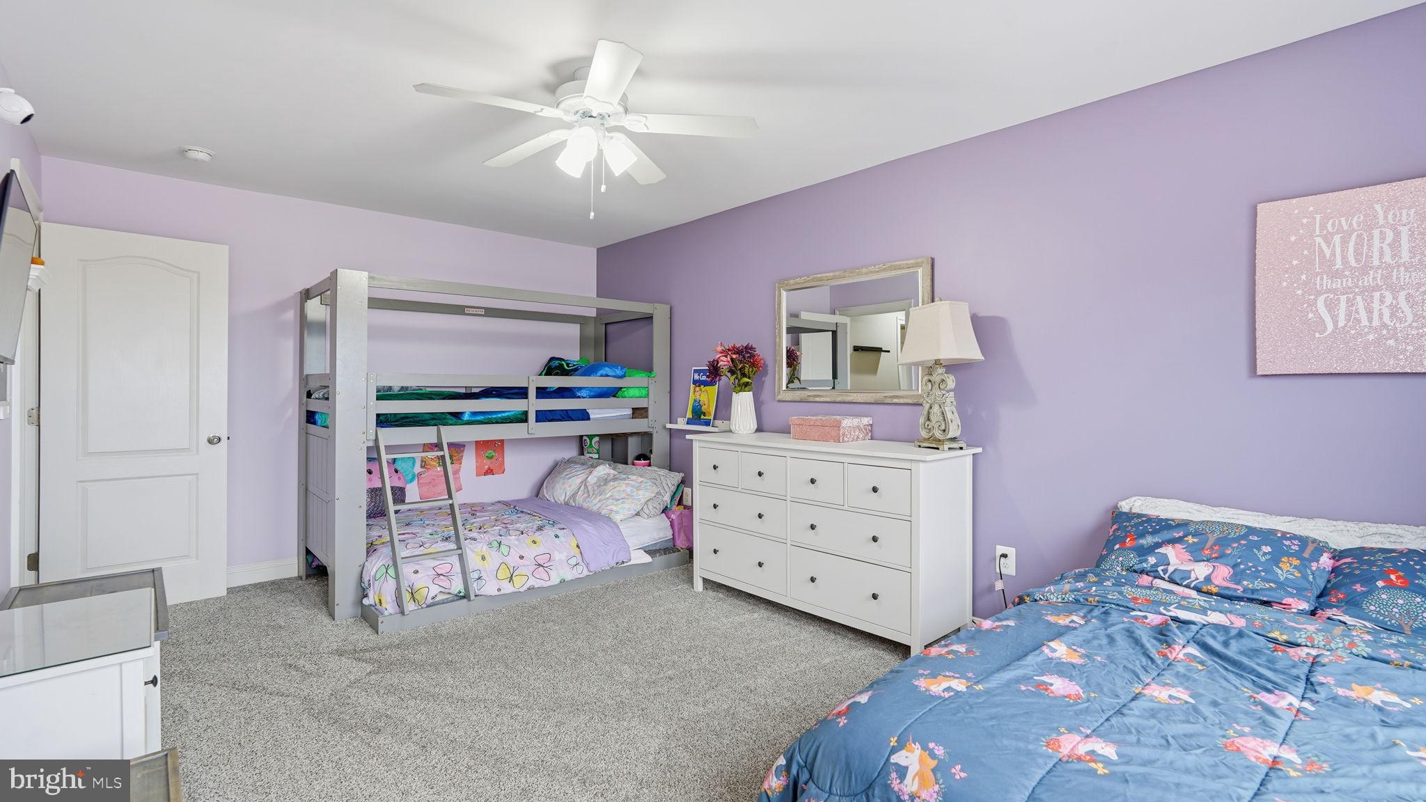 111 Pear Blossom Road Stafford, VA 22554 - Photo 28 of 68 a bedroom with a bed and a chandelier