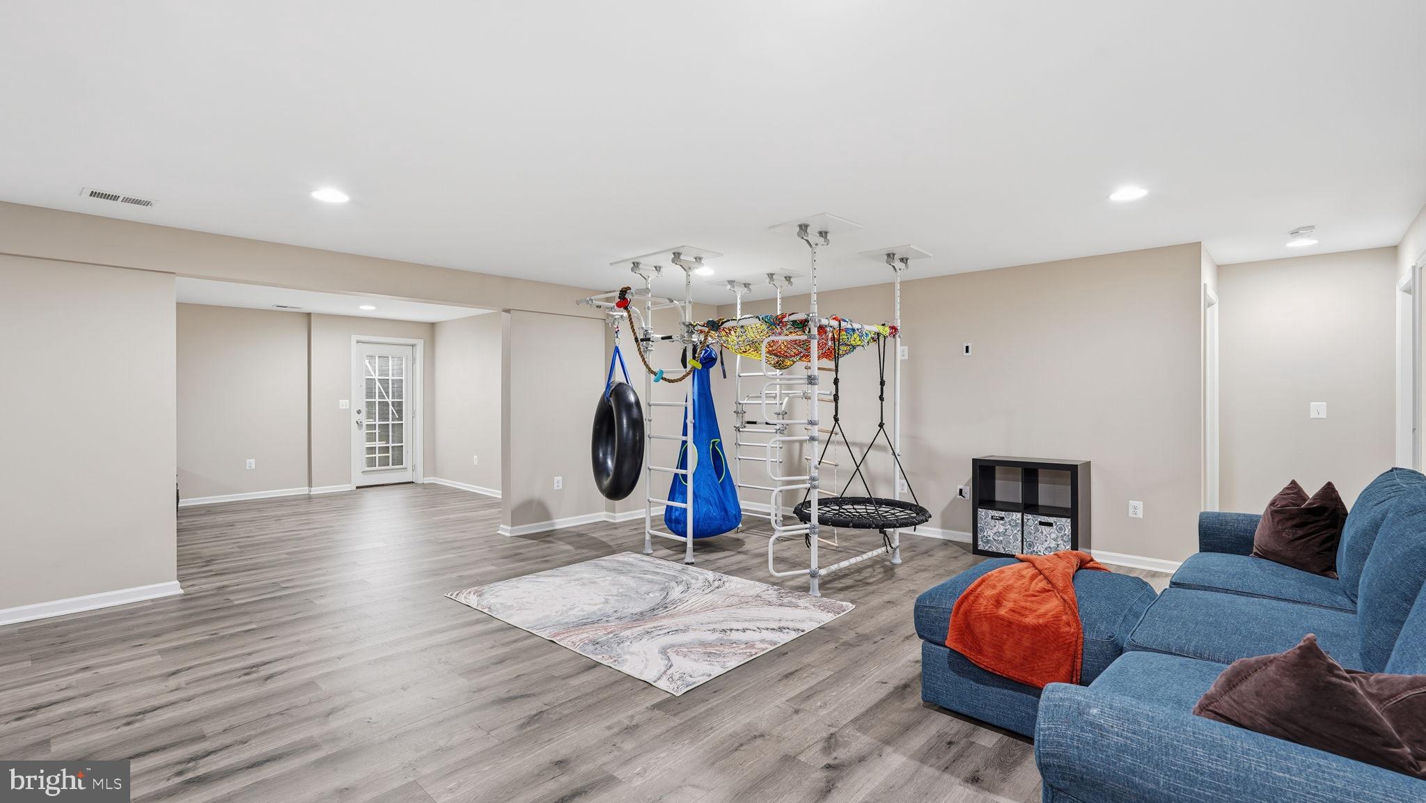 111 Pear Blossom Road Stafford, VA 22554 - Photo 29 of 68 a living room with furniture and a wooden floor