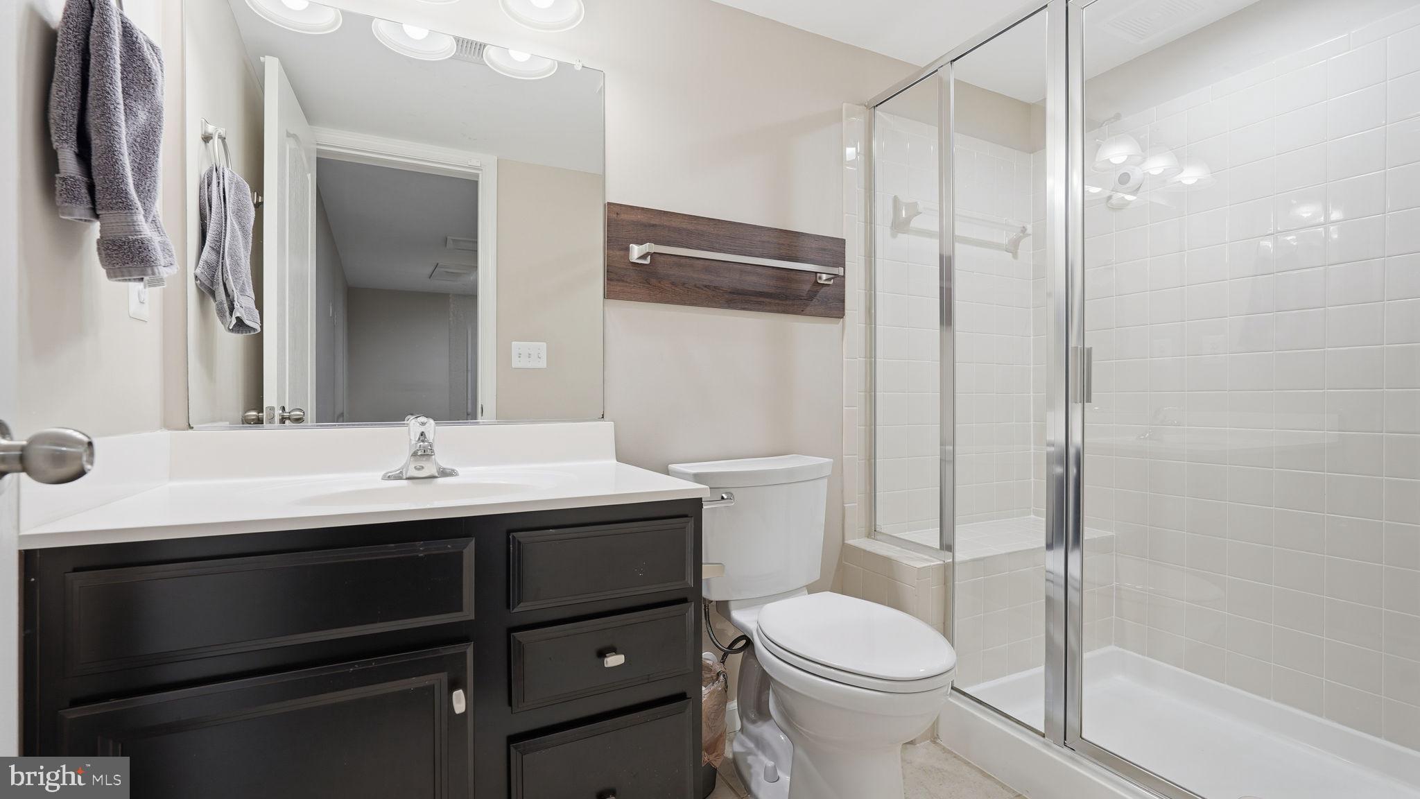 111 Pear Blossom Road Stafford, VA 22554 - Photo 33 of 68 a bathroom with a sink toilet and shower