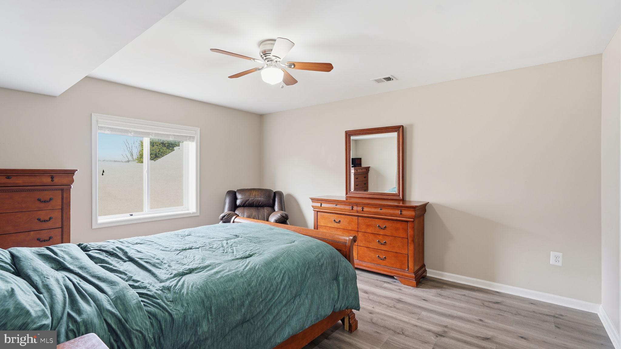111 Pear Blossom Road Stafford, VA 22554 - Photo 35 of 68 a bedroom with a bed and a dresser