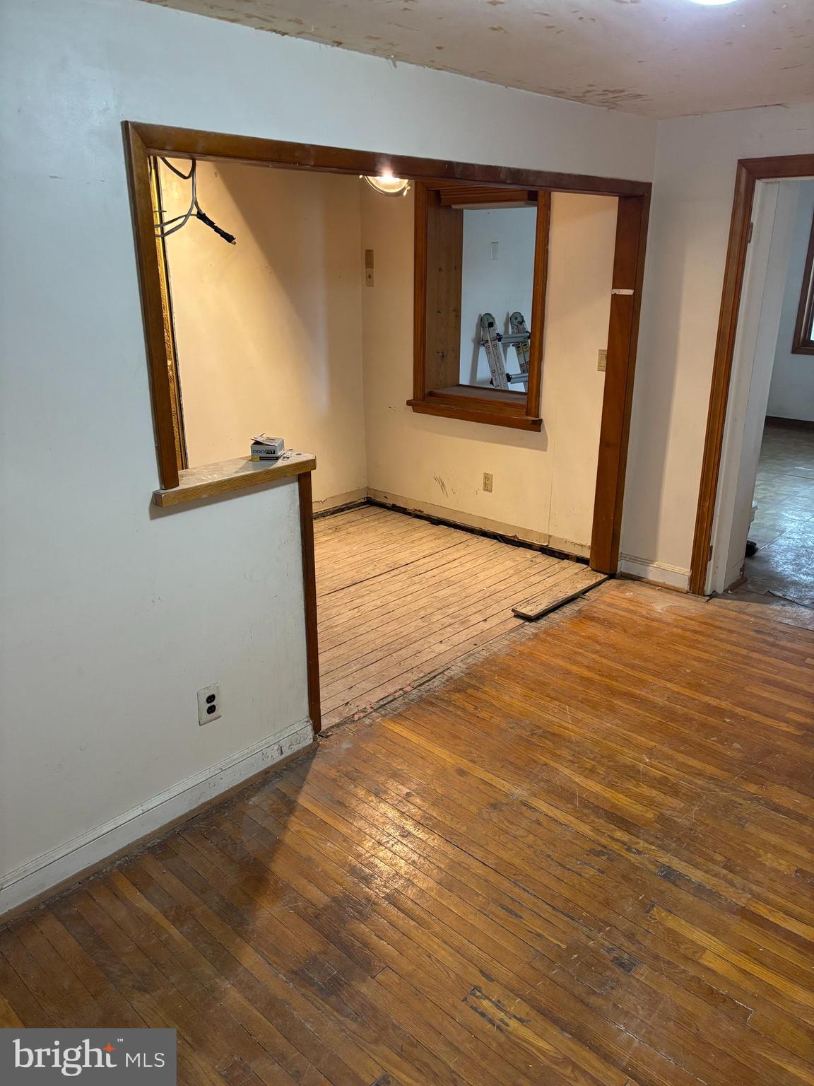 18 Southridge Road Darby, PA 19023 - Photo 8 of 13 a view of an empty room with wooden floor and a window