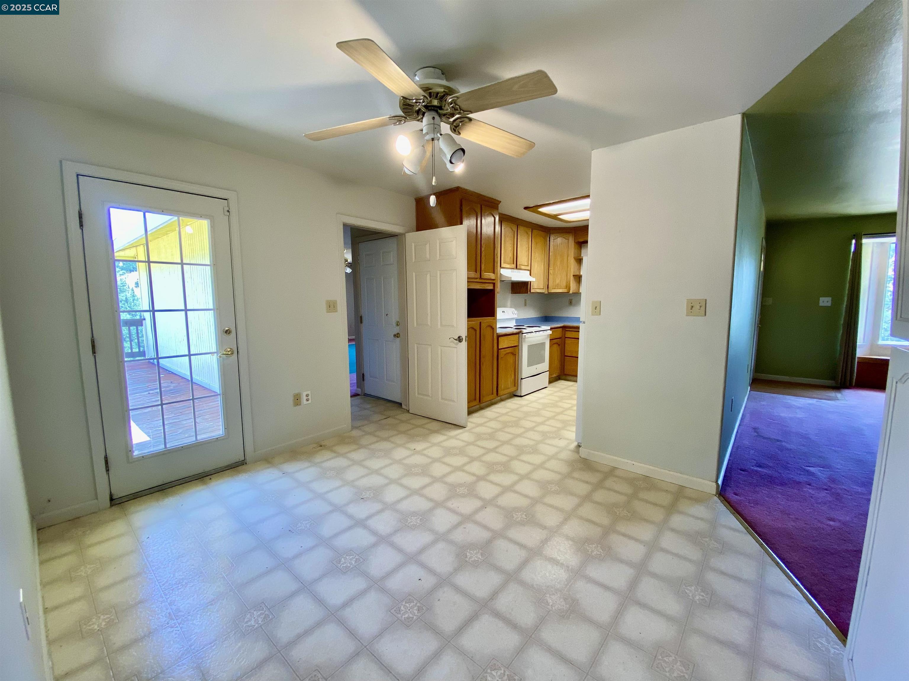2707 River View Road Clearlake Oaks, CA 95423 - Photo 6 of 18 a view of a kitchen with a sink and a refrigerator