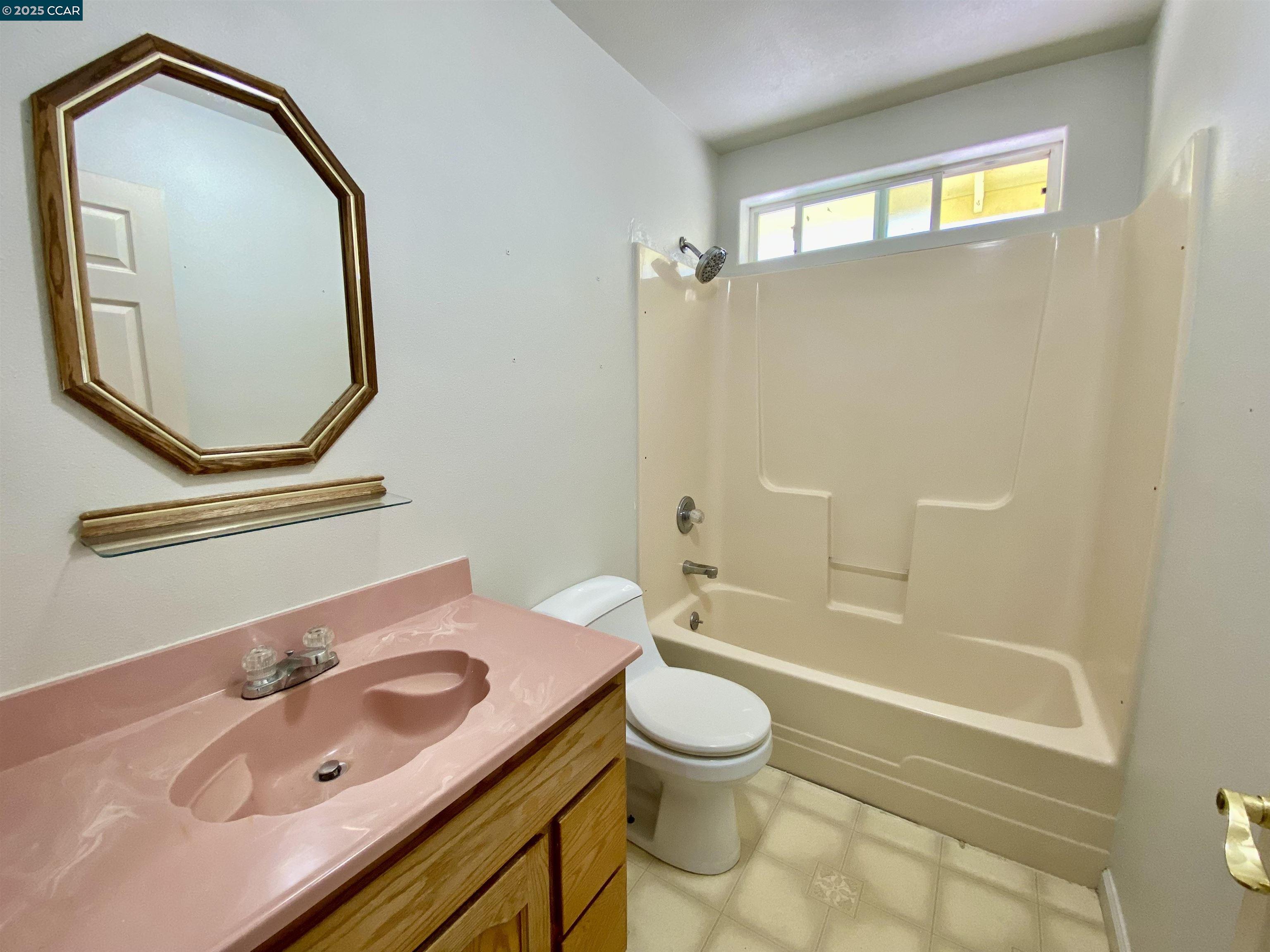 2707 River View Road Clearlake Oaks, CA 95423 - Photo 10 of 18 a bathroom with a sink a toilet and a mirror