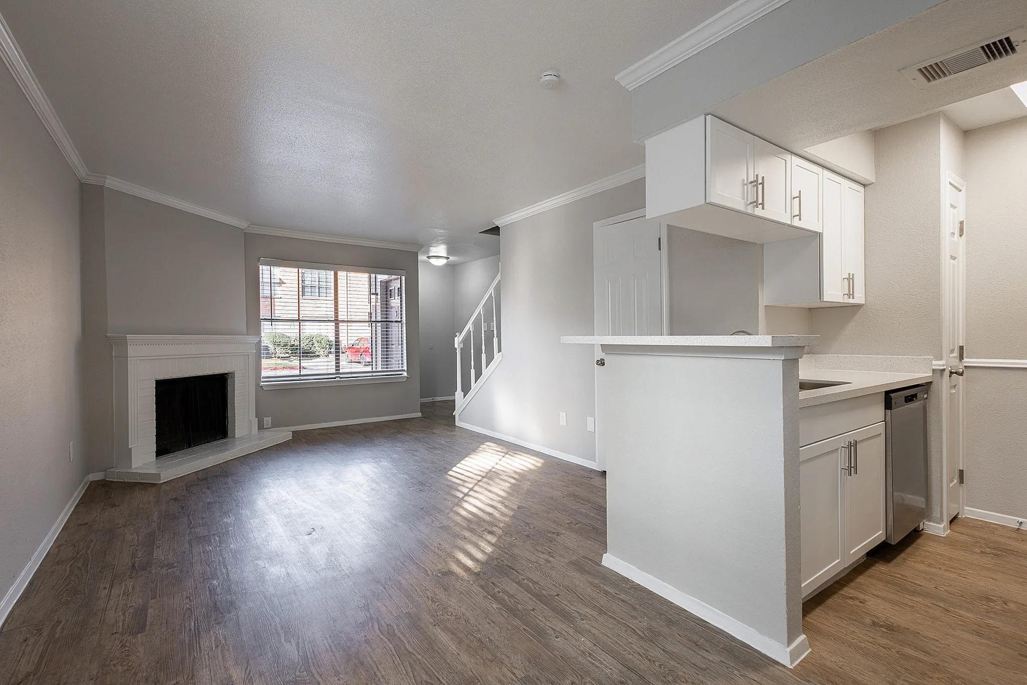 1230 Farm To Market 1960 Bypass Road East, Unit 713 Humble, TX 77338 - Photo 15 of 20 a view of kitchen and entryway with wooden floor
