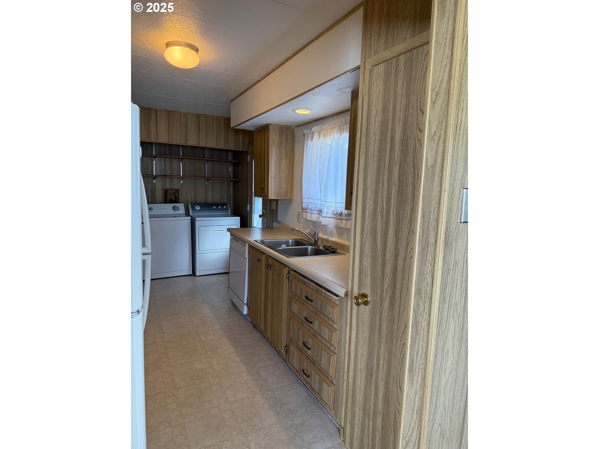 5422 Portland Road Northeast, Unit 47 Salem, OR 97305 - Photo 13 of 45 a kitchen with stainless steel appliances granite countertop a sink and cabinets