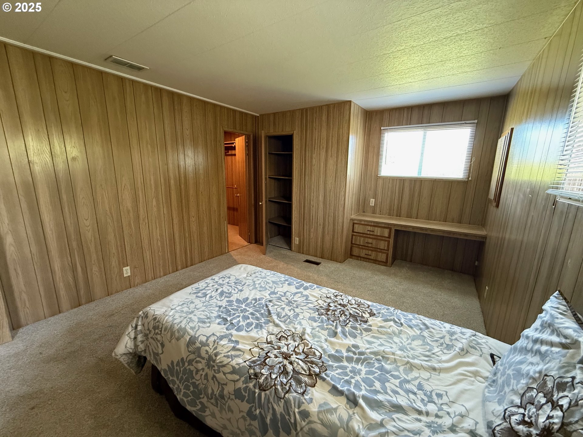 5422 Portland Road Northeast, Unit 47 Salem, OR 97305 - Photo 19 of 45 a bedroom with a bed and a window