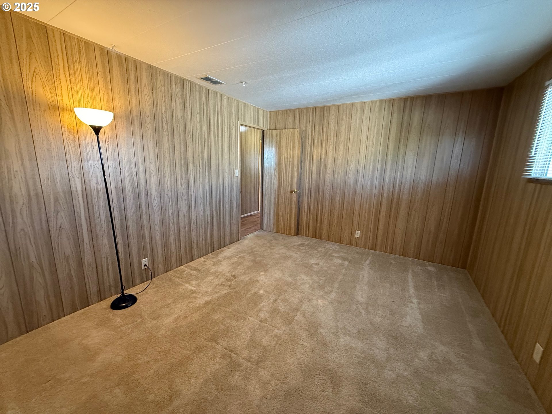 5422 Portland Road Northeast, Unit 47 Salem, OR 97305 - Photo 30 of 45 a view of a room with a wooden wall