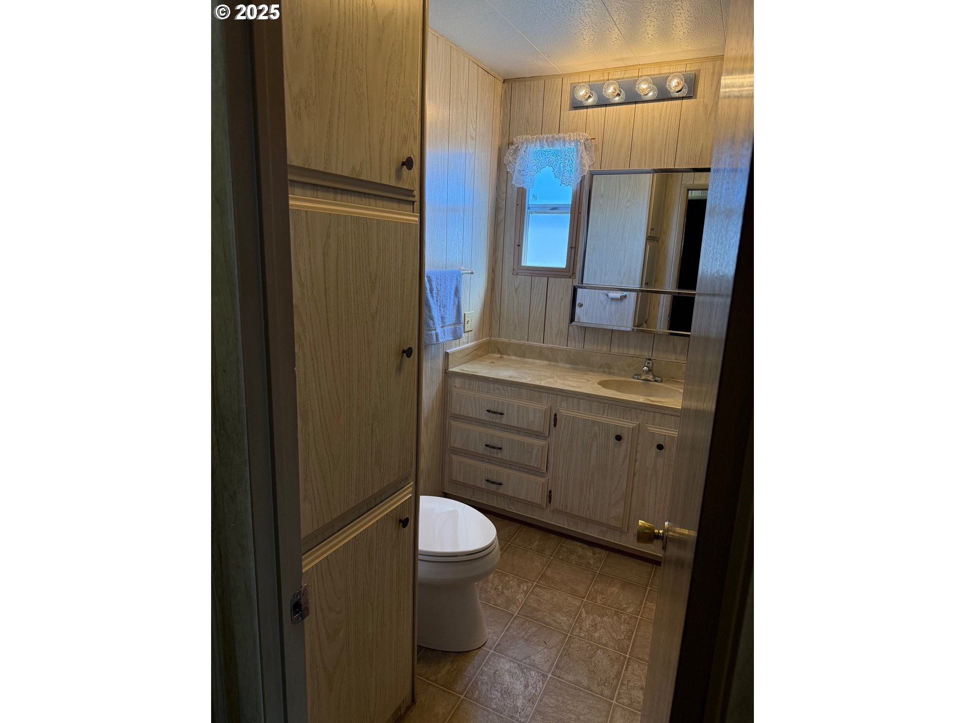 5422 Portland Road Northeast, Unit 47 Salem, OR 97305 - Photo 31 of 45 a bathroom with a granite countertop sink and a mirror