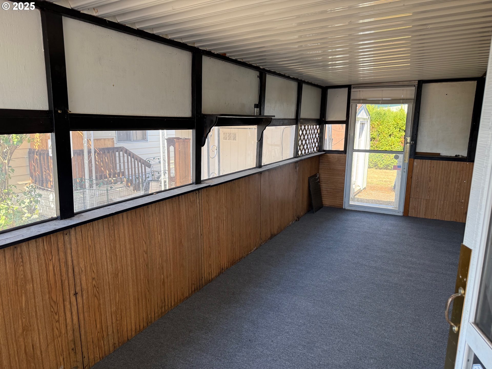 5422 Portland Road Northeast, Unit 47 Salem, OR 97305 - Photo 4 of 45 a view of an empty room with a window