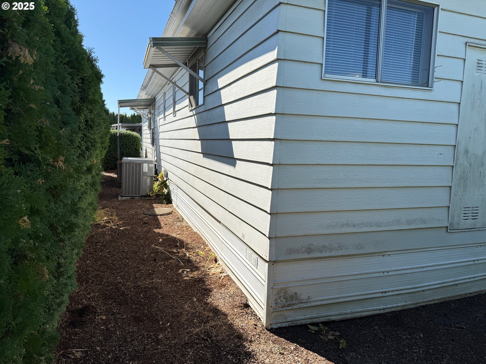 5422 Portland Road Northeast, Unit 47 Salem, OR 97305 - Photo 44 of 45 a view of a house with a yard