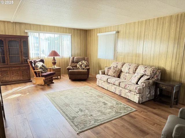 a living room with furniture and a rug