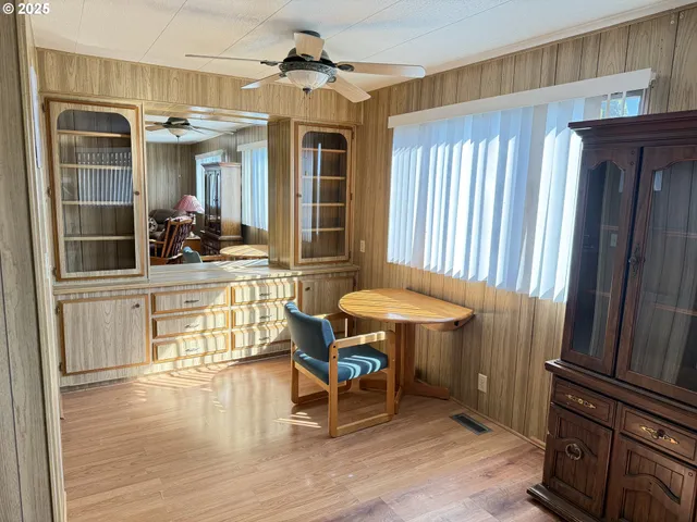 a view of a livingroom with furniture and a window