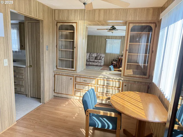 a view of a dining room with furniture and front door