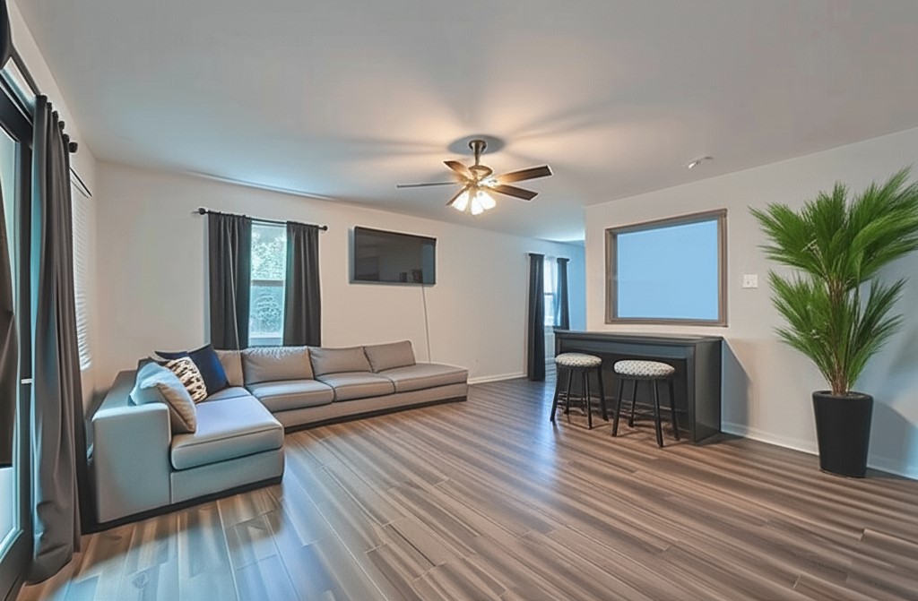 7706 Ashmole Lane Houston, TX 77088 - Photo 4 of 16 This oversized flex room offers modern flooring, updated lighting, and space to entertain or relax. Ideal as a game room, lounge, or family retreat.