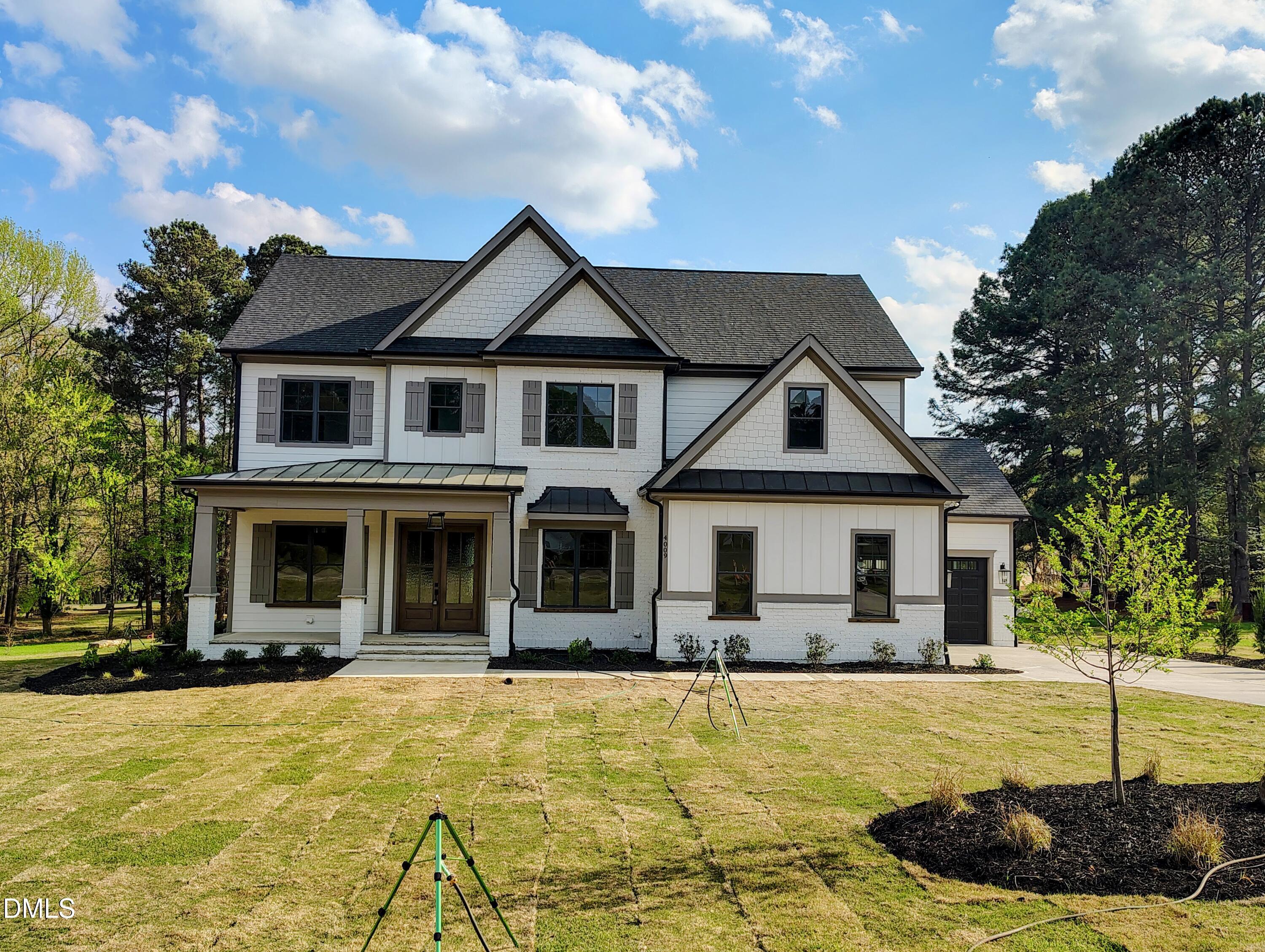 4009 Yates Mill Pond Road Raleigh, NC 27606 - Photo 2 of 52 a front view of a house with a yard