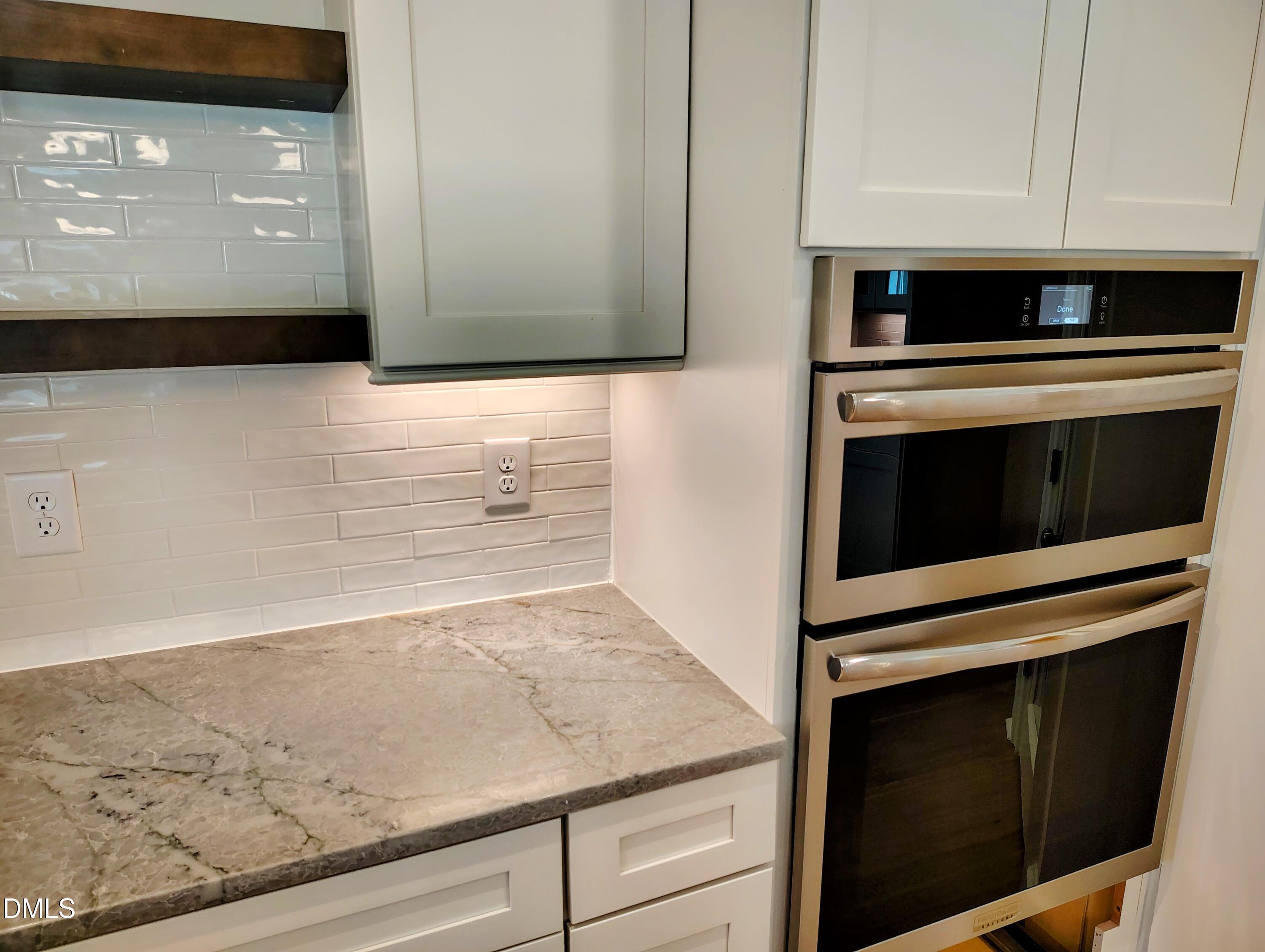 4009 Yates Mill Pond Road Raleigh, NC 27606 - Photo 23 of 52 a stove top oven sitting inside of a kitchen