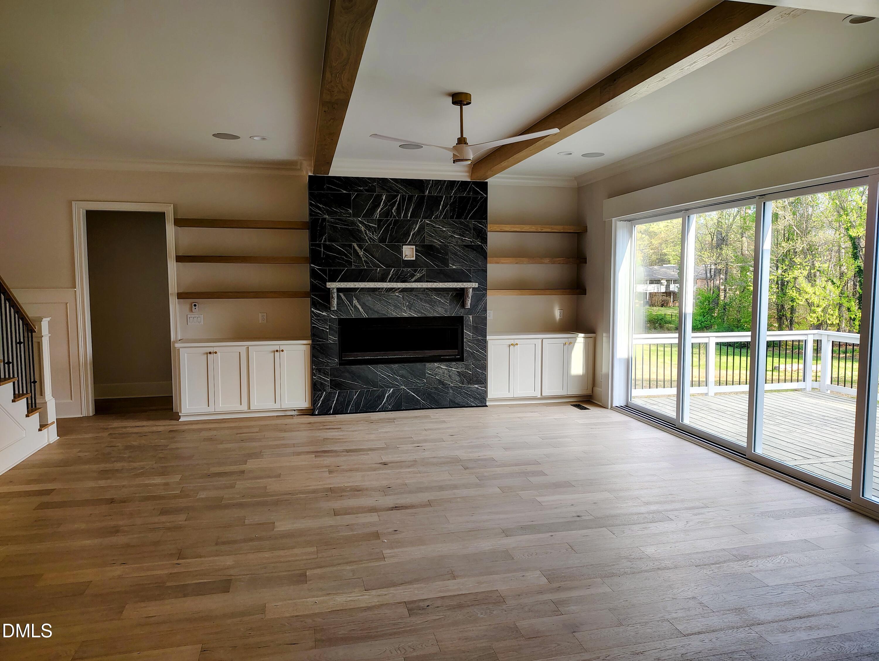 4009 Yates Mill Pond Road Raleigh, NC 27606 - Photo 24 of 52 a view of an empty room with a fireplace and a window