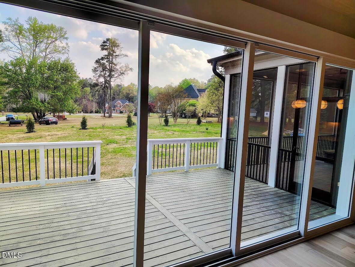 4009 Yates Mill Pond Road Raleigh, NC 27606 - Photo 26 of 52 a view of a balcony with wooden floor