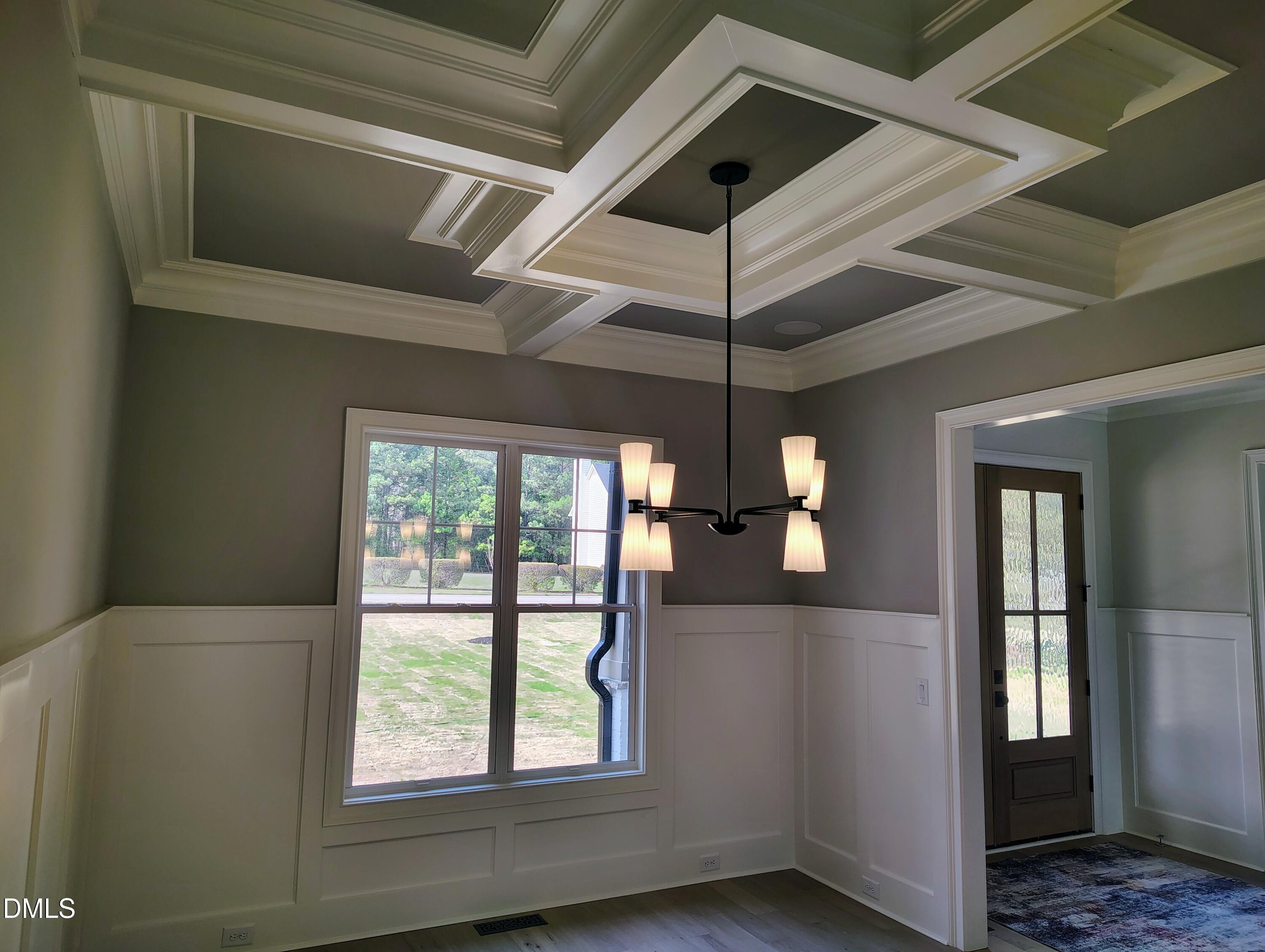 4009 Yates Mill Pond Road Raleigh, NC 27606 - Photo 29 of 52 a view of empty room with window and chandelier