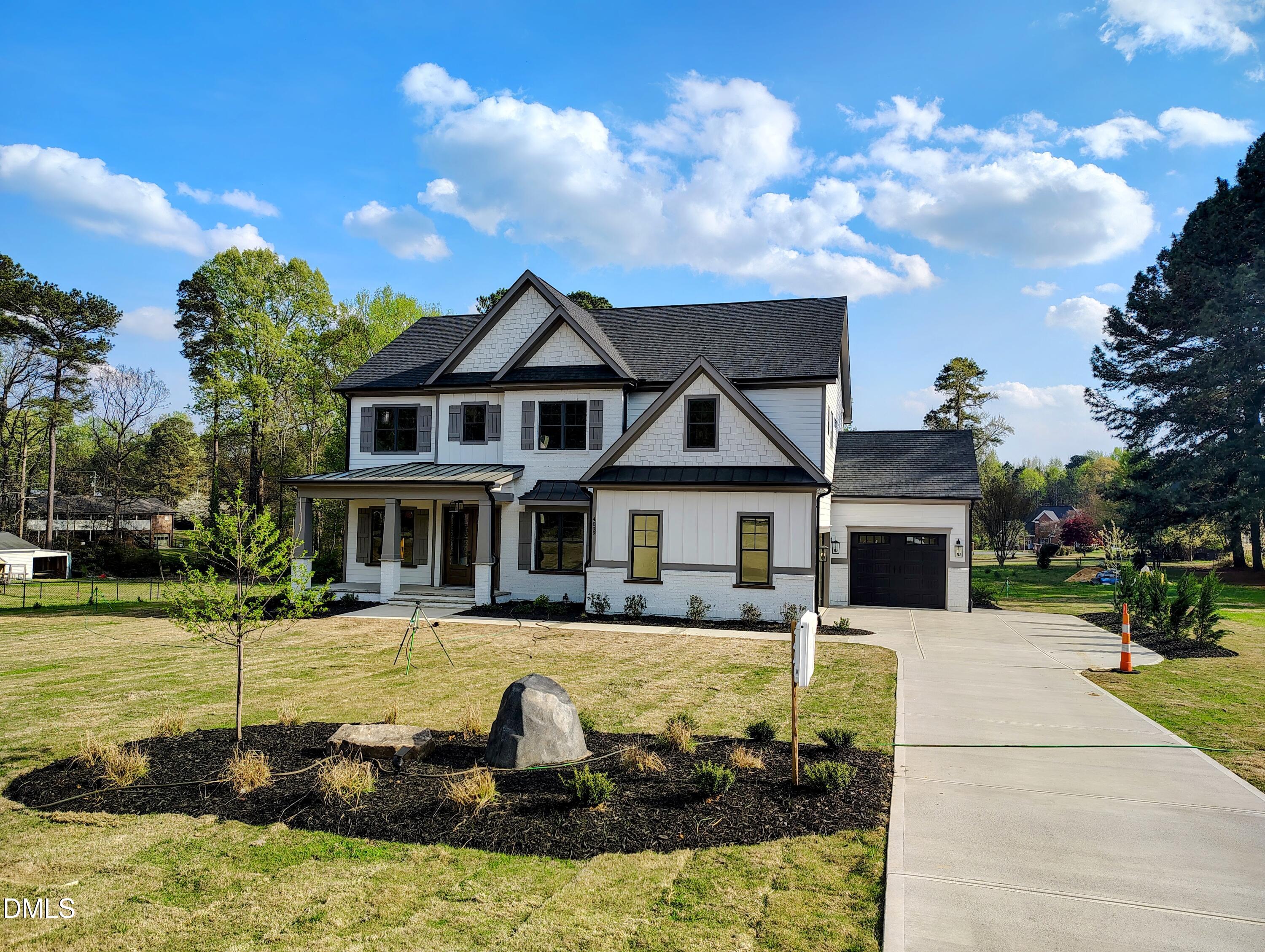 4009 Yates Mill Pond Road Raleigh, NC 27606 - Photo 3 of 52 a front view of a house with garden