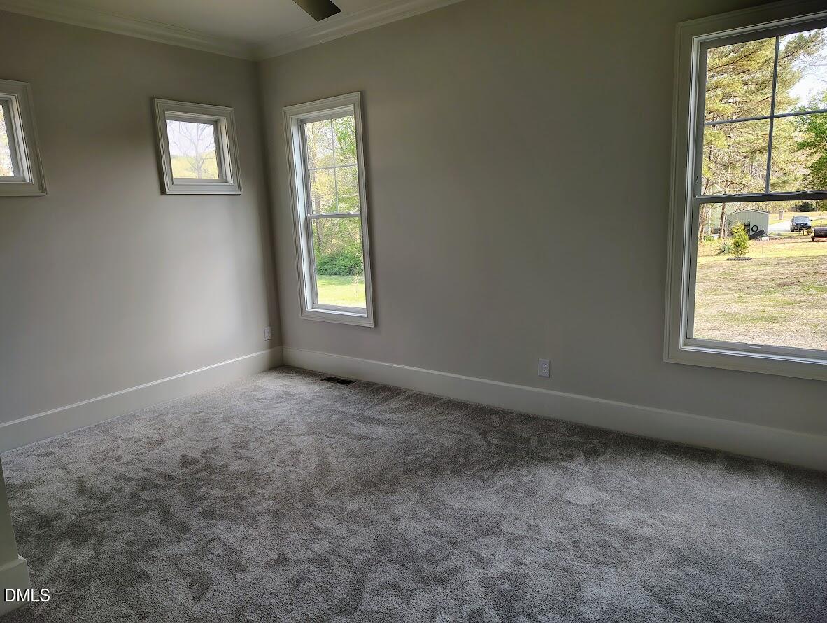 4009 Yates Mill Pond Road Raleigh, NC 27606 - Photo 31 of 52 an empty room with a window