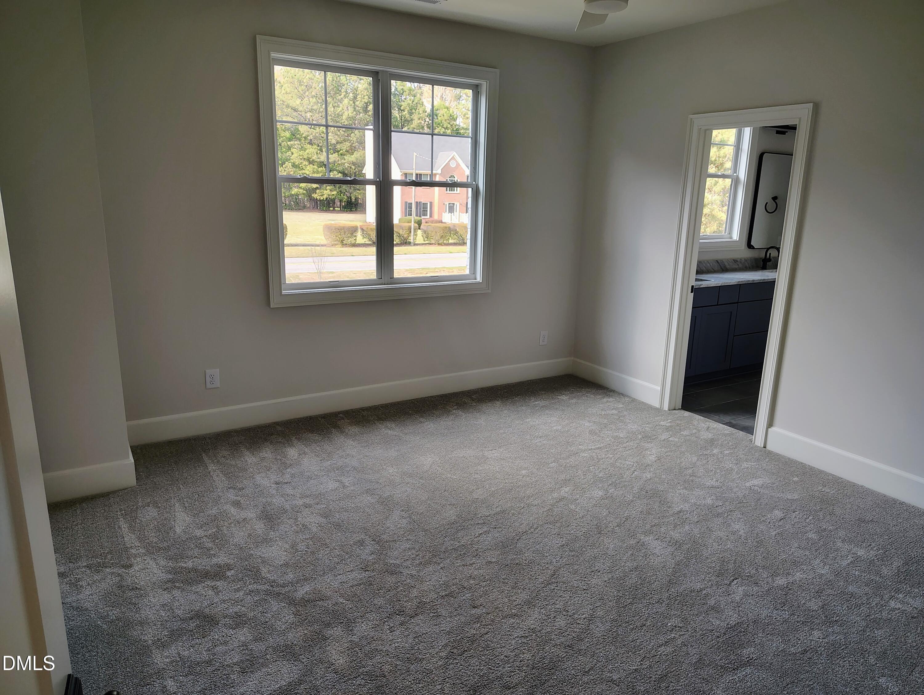 4009 Yates Mill Pond Road Raleigh, NC 27606 - Photo 41 of 52 an empty room with windows