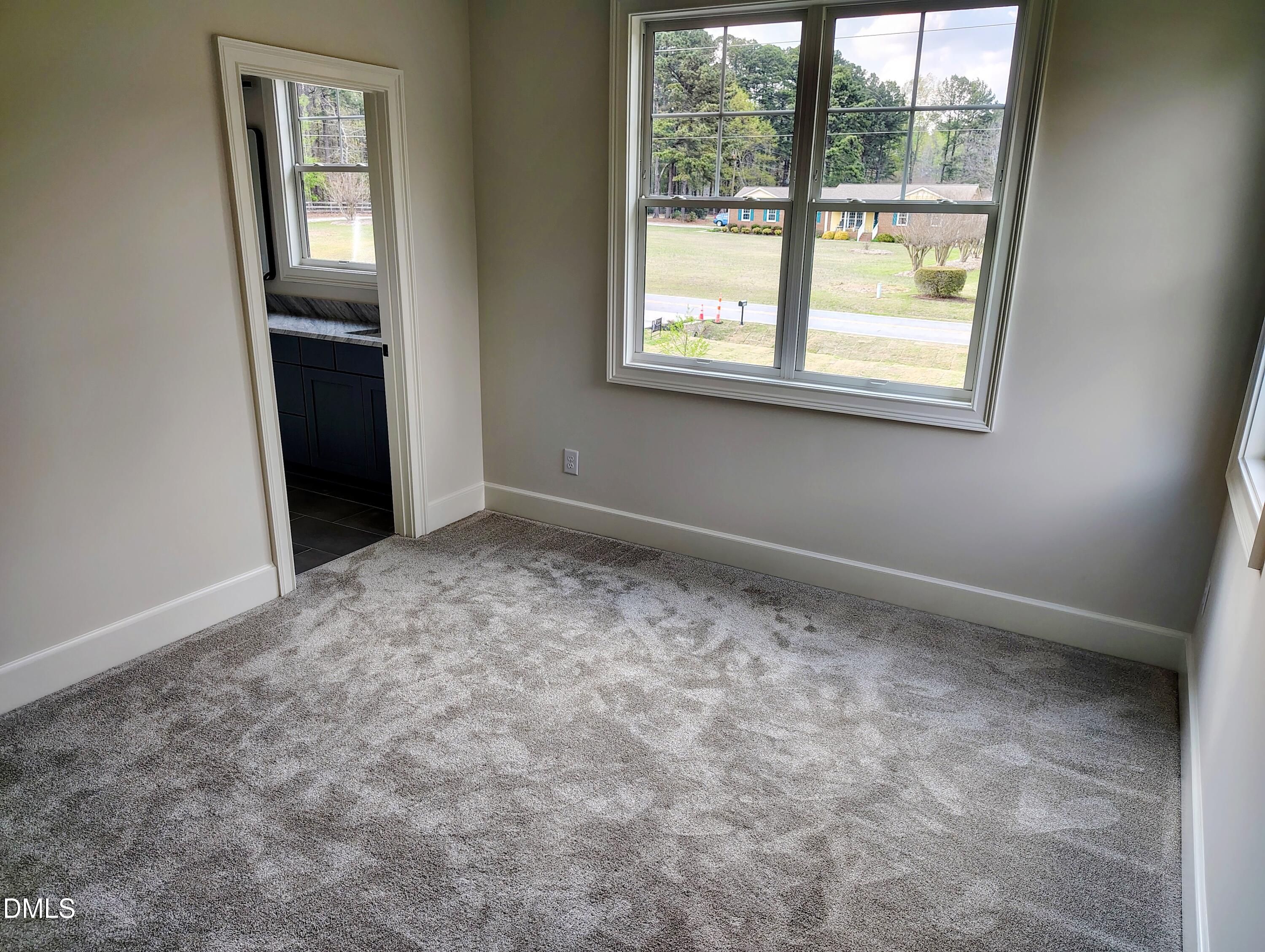 4009 Yates Mill Pond Road Raleigh, NC 27606 - Photo 43 of 52 an empty room with a window