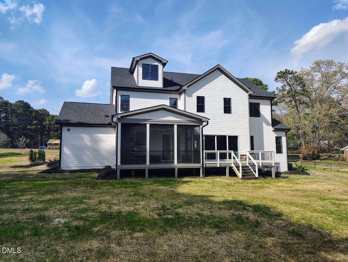 4009 Yates Mill Pond Road Raleigh, NC 27606 - Photo 8 of 52 a front view of a house with a yard