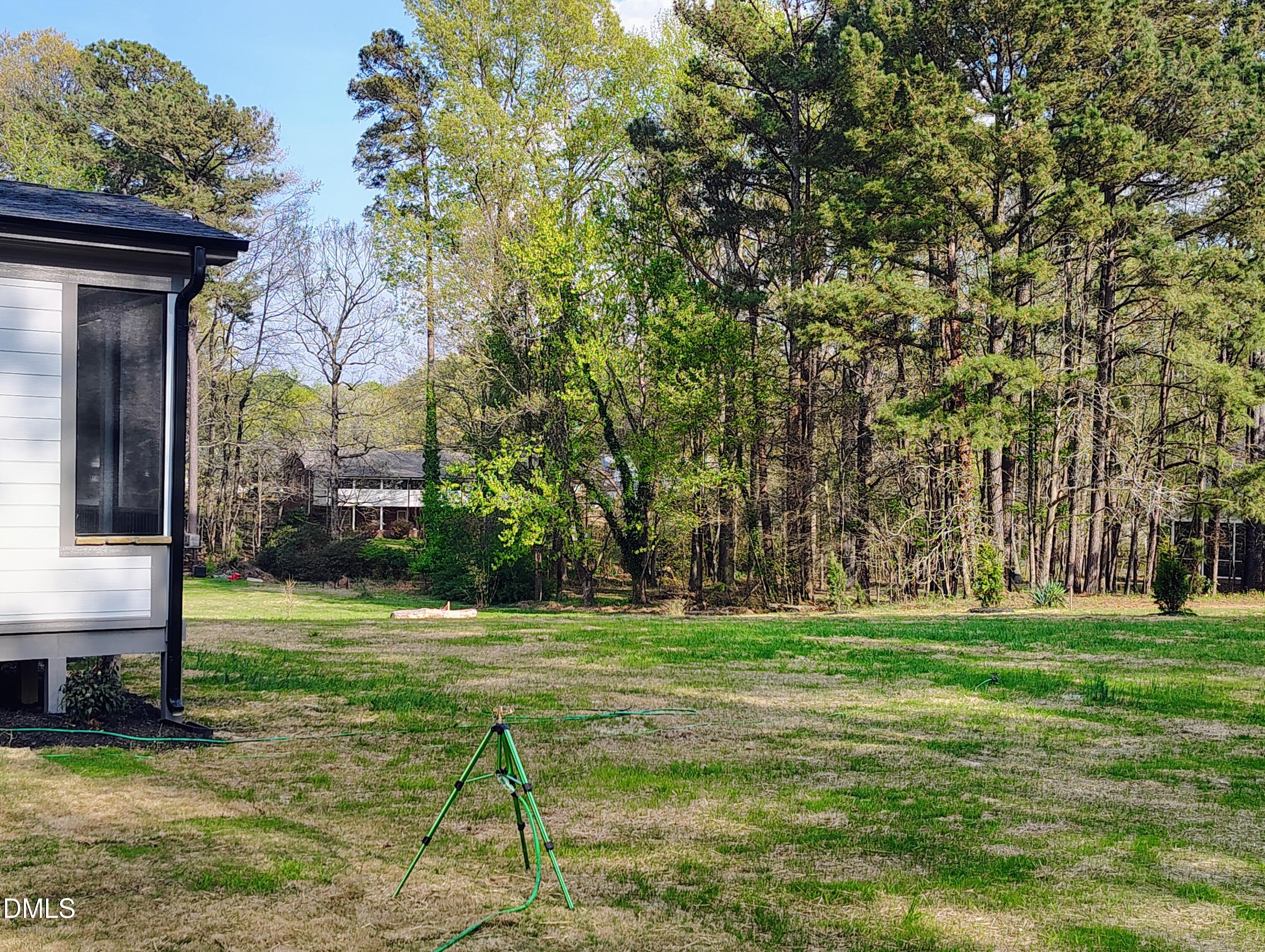 4009 Yates Mill Pond Road Raleigh, NC 27606 - Photo 9 of 52 a garden view with a seating space
