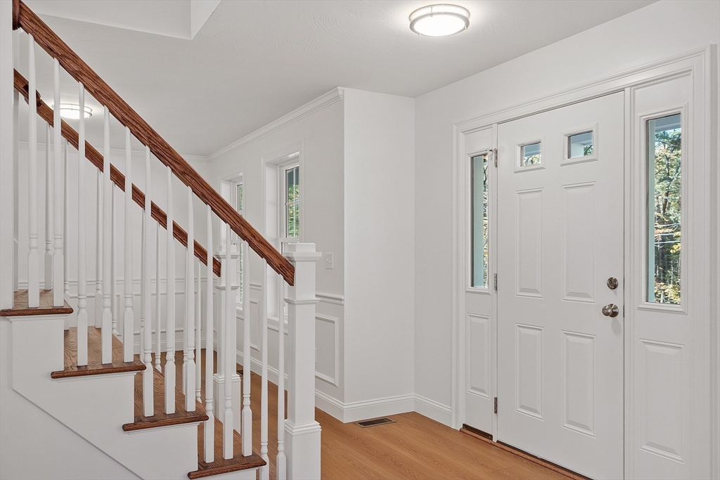 0 Gardner Road, Unit APPLEWOOD Templeton, MA 01468 - Photo 21 of 36 a view of front door with wooden floor and stairs