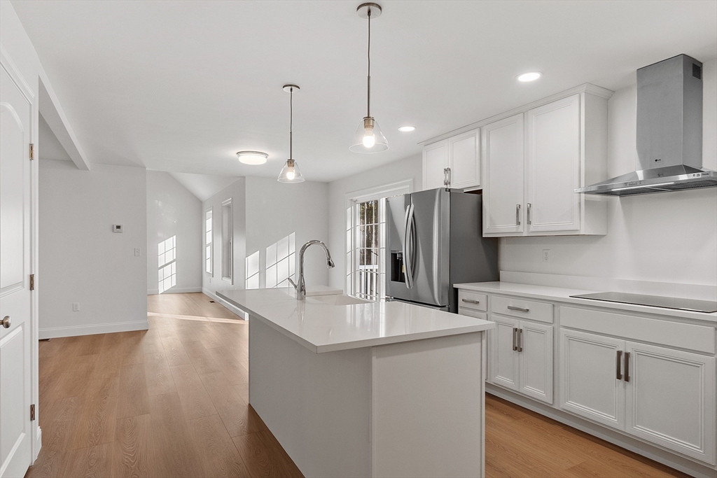 0 Gardner Road, Unit APPLEWOOD Templeton, MA 01468 - Photo 22 of 36 a kitchen with stainless steel appliances kitchen island a refrigerator sink and cabinets