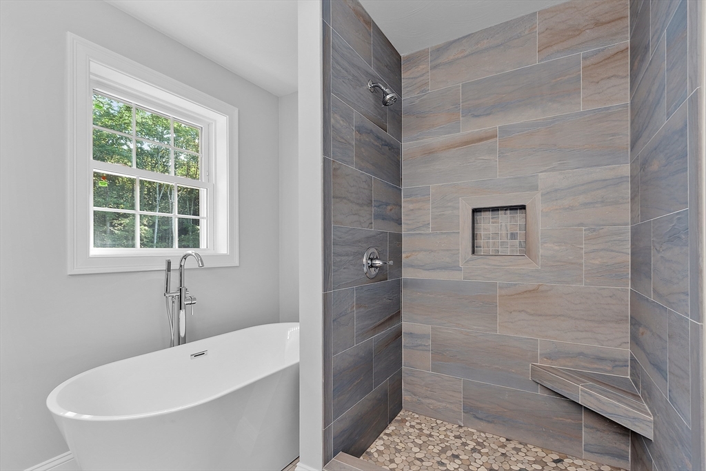0 Gardner Road, Unit APPLEWOOD Templeton, MA 01468 - Photo 28 of 36 a bathroom with a tub a window and a shower
