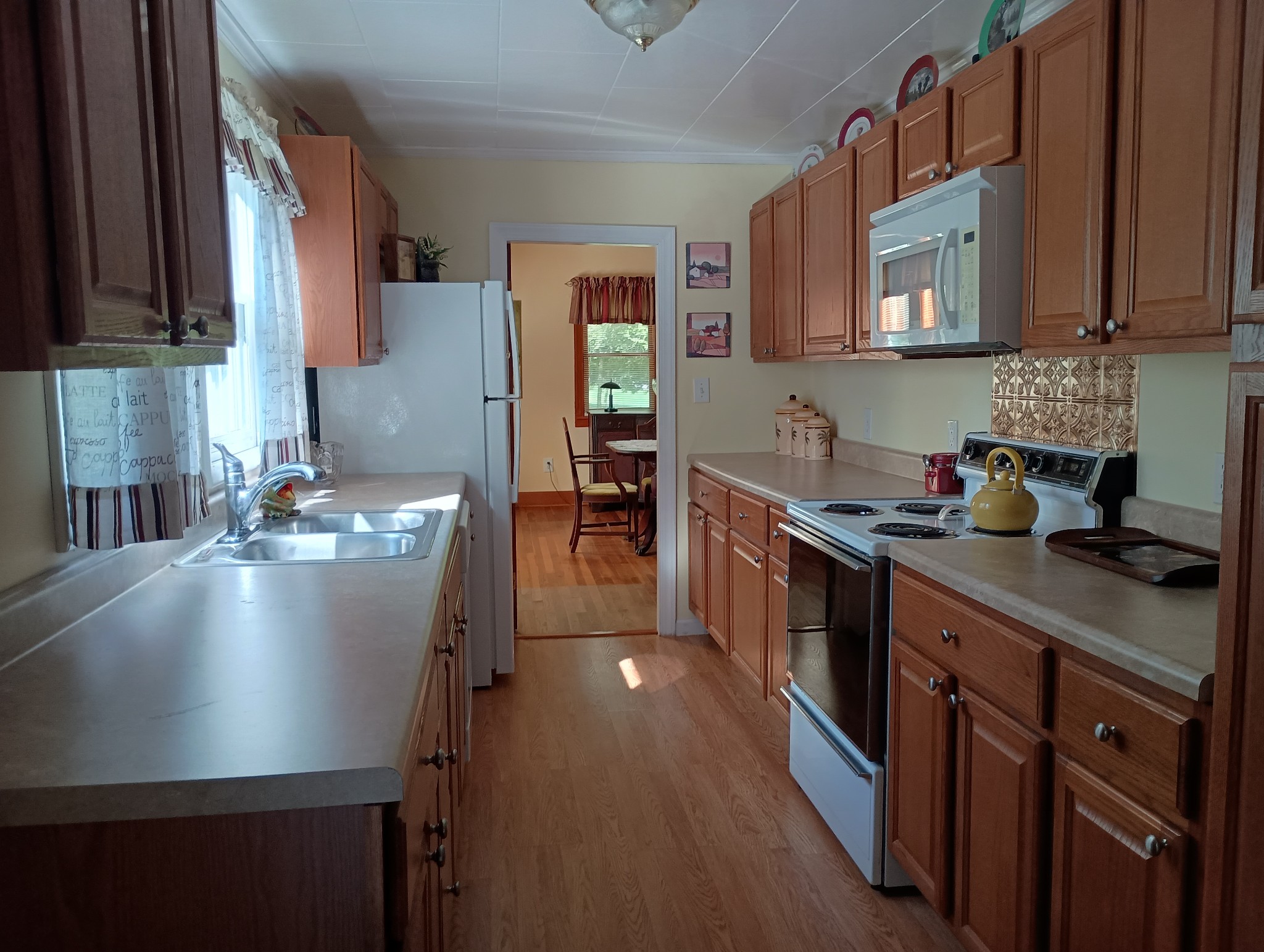 226 Lake O'Donnell Road Sewanee, TN 37375 - Photo 17 of 40 a kitchen with stainless steel appliances granite countertop a sink stove and cabinets