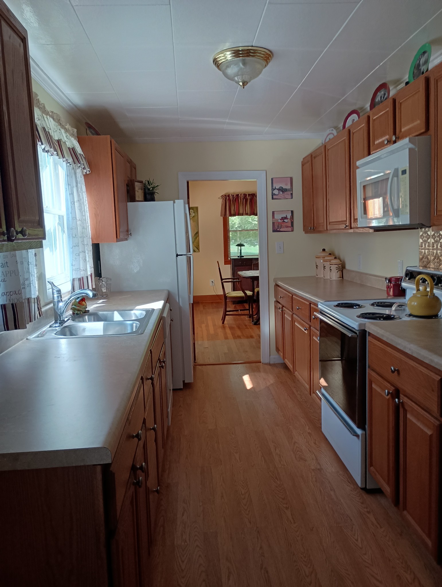 226 Lake O'Donnell Road Sewanee, TN 37375 - Photo 18 of 40 a kitchen with stainless steel appliances granite countertop a sink stove and refrigerator