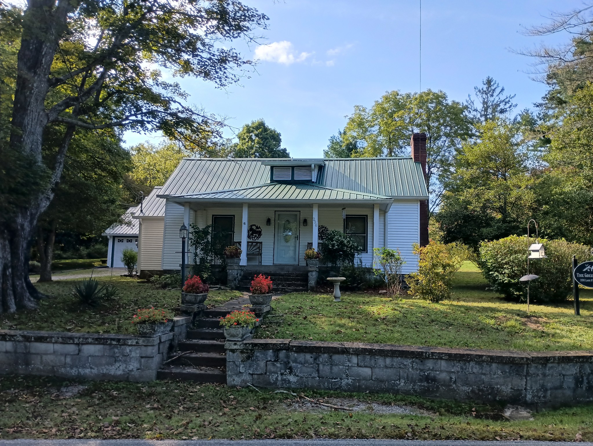 226 Lake O'Donnell Road Sewanee, TN 37375 - Photo 2 of 40 a front view of a house with garden