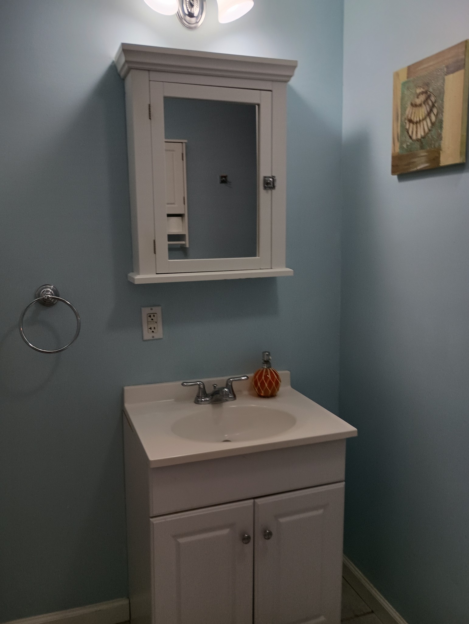 226 Lake O'Donnell Road Sewanee, TN 37375 - Photo 30 of 40 a bathroom with a sink a vanity and mirror