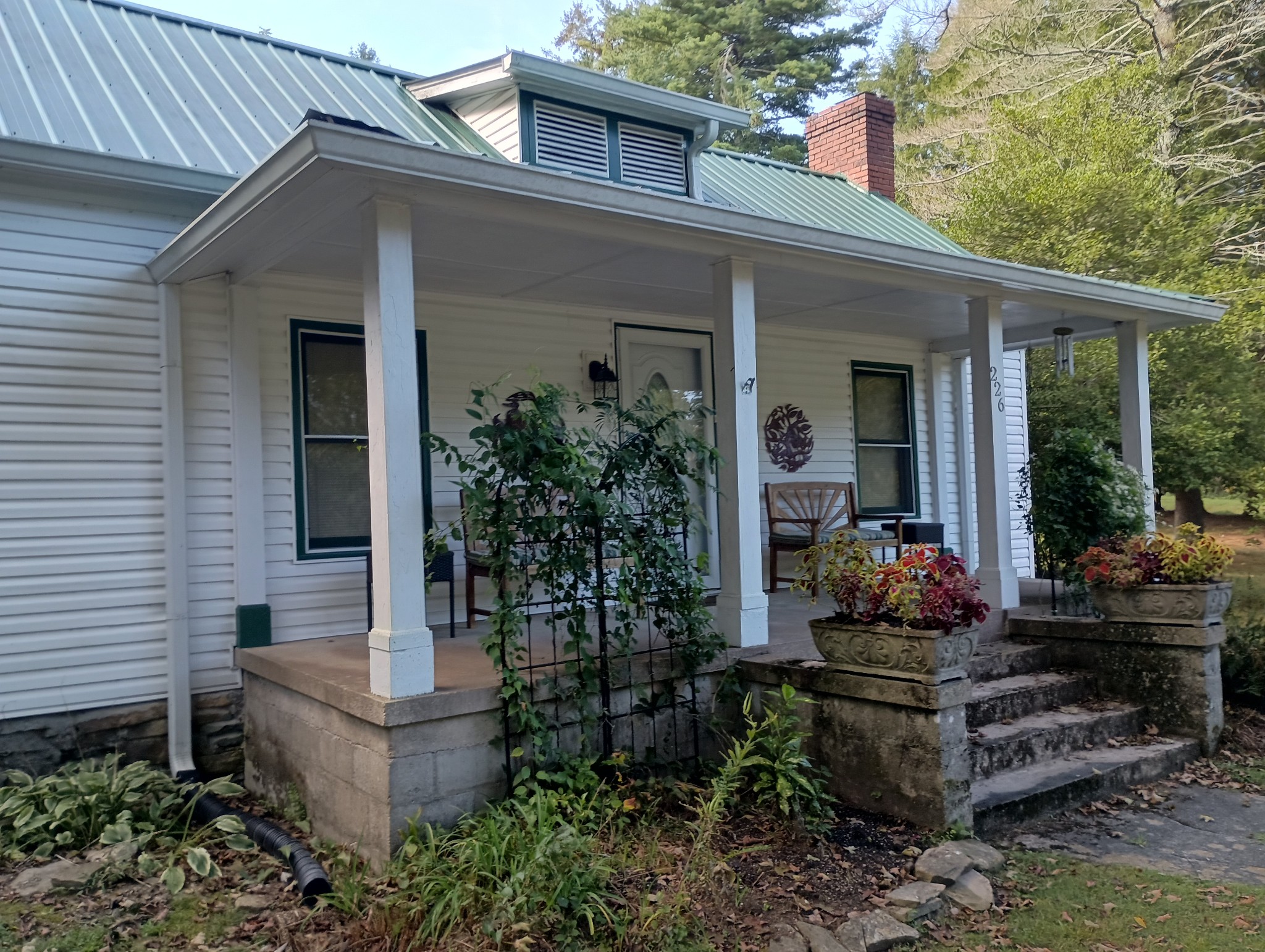 226 Lake O'Donnell Road Sewanee, TN 37375 - Photo 3 of 40 a front view of a house with garden