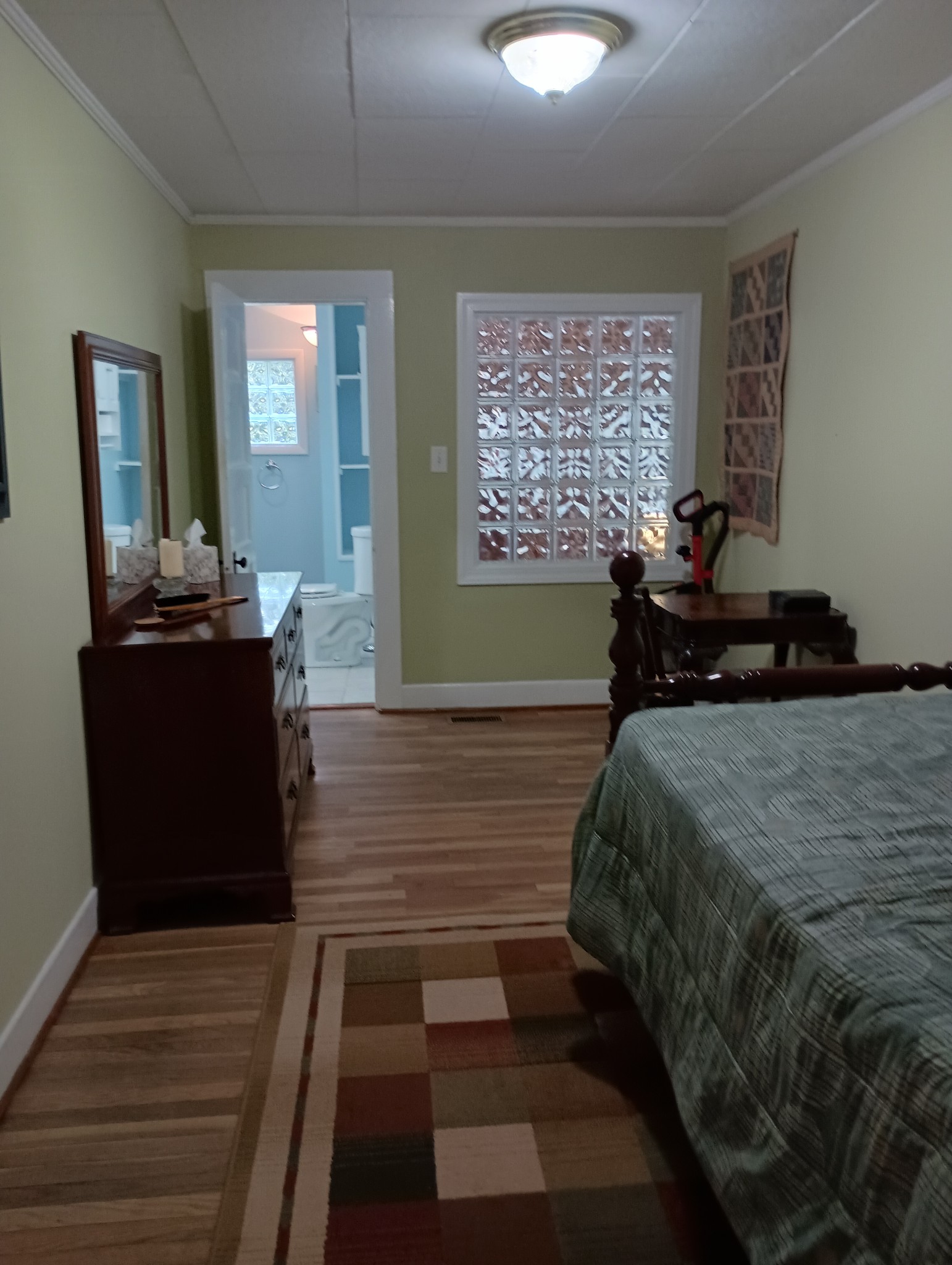 226 Lake O'Donnell Road Sewanee, TN 37375 - Photo 33 of 40 a bedroom with a bed and wooden floor