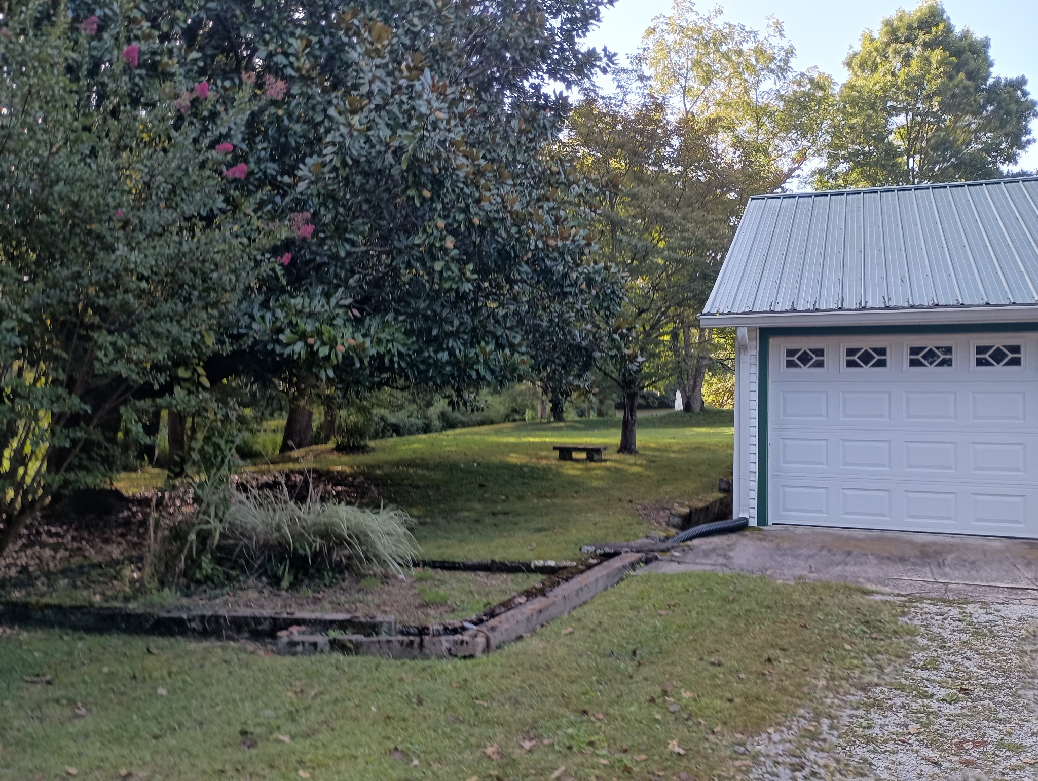 226 Lake O'Donnell Road Sewanee, TN 37375 - Photo 8 of 40 a view of a barn in the middle of a yard