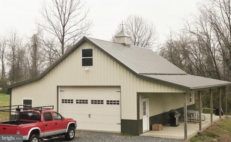 7224 Gilardi Road Boonsboro, MD 21713 - Photo 11 of 30 a front view of a house with parking space