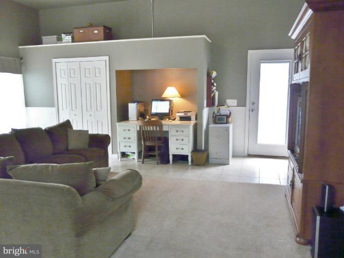 7224 Gilardi Road Boonsboro, MD 21713 - Photo 13 of 30 a living room with furniture and a fireplace