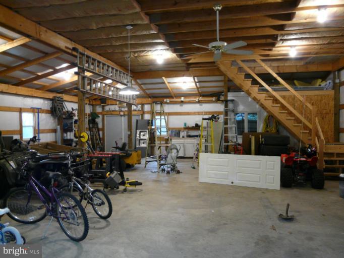 7224 Gilardi Road Boonsboro, MD 21713 - Photo 23 of 30 a view of gym with garage
