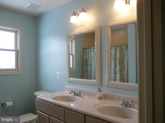 7224 Gilardi Road Boonsboro, MD 21713 - Photo 25 of 30 a bathroom with a sink and a mirror