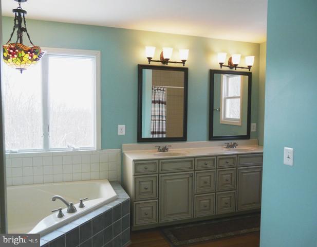 7224 Gilardi Road Boonsboro, MD 21713 - Photo 26 of 30 a bathroom with a sink and a mirror