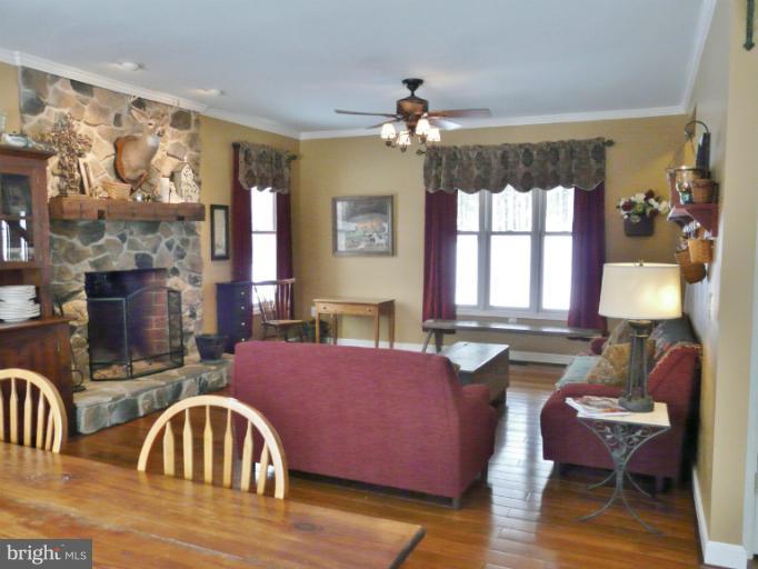 7224 Gilardi Road Boonsboro, MD 21713 - Photo 9 of 30 a view of a dining room with furniture window and wooden floor
