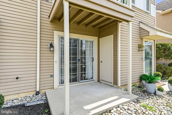 an aerial view of a house with a yard basket ball court and outdoor seating