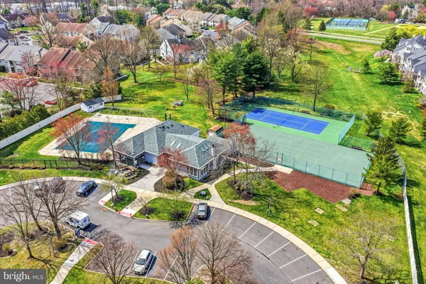 an aerial view of a house with a backyard