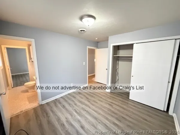 a view of an empty room and wooden floor