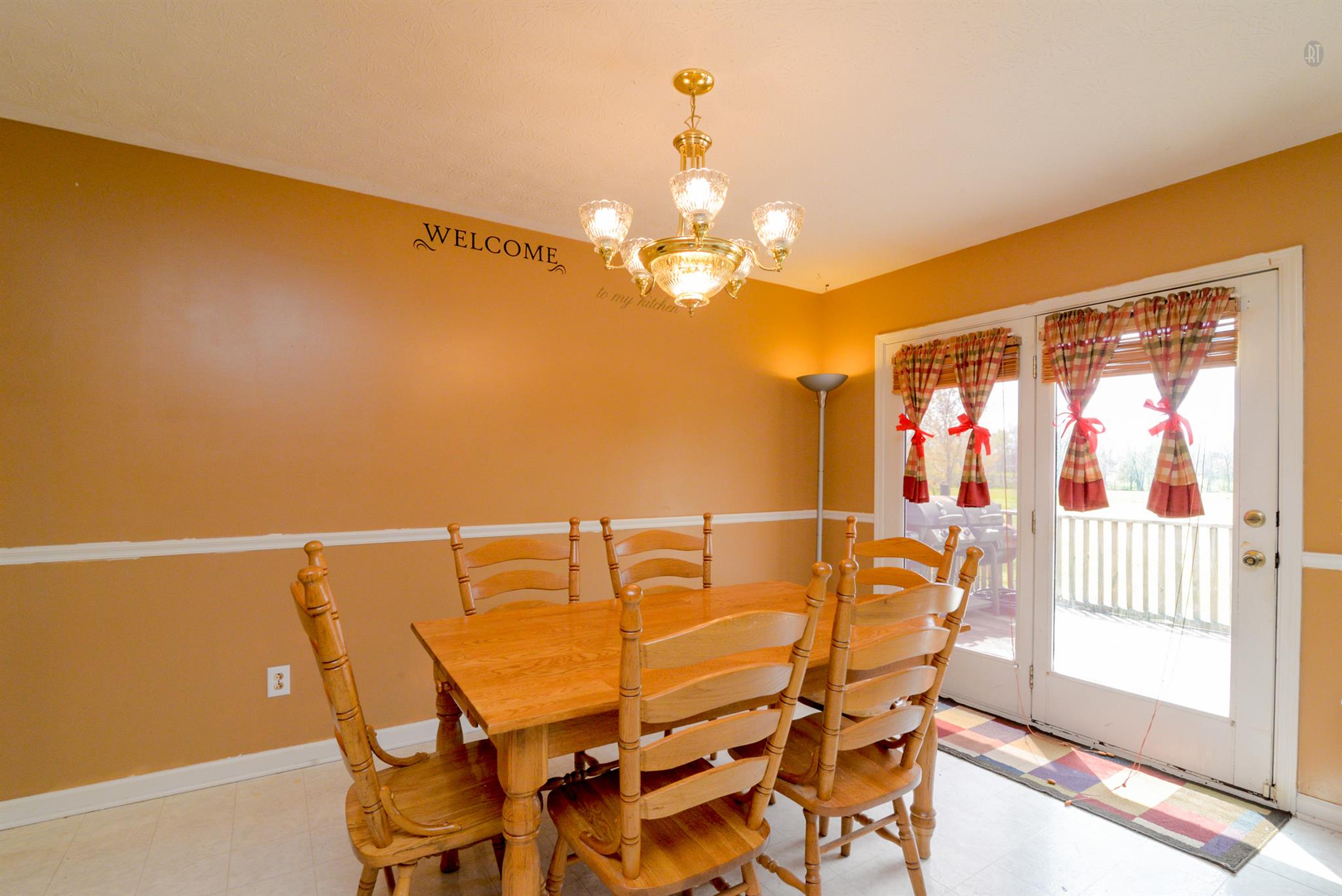 244 T G T Road Portland, TN 37148 - Photo 3 of 10 a view of a dining room with furniture and chandelier